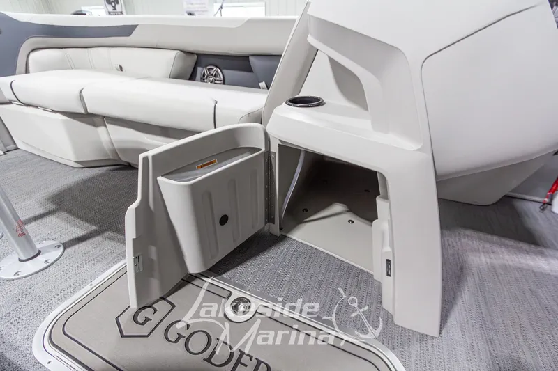Slide: The Image of 2026 Godfrey Monaco 235 SFLC boat interior with open storage compartment and seating. - 9