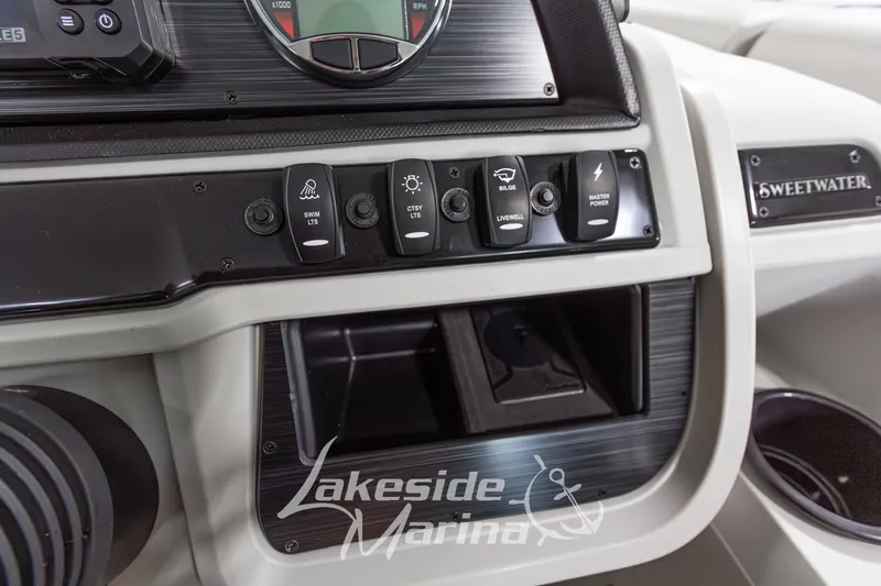 Slide: The Image of Control panel of 2026 Godfrey Monaco 235 SFLC boat with various switches and gauges. - 18