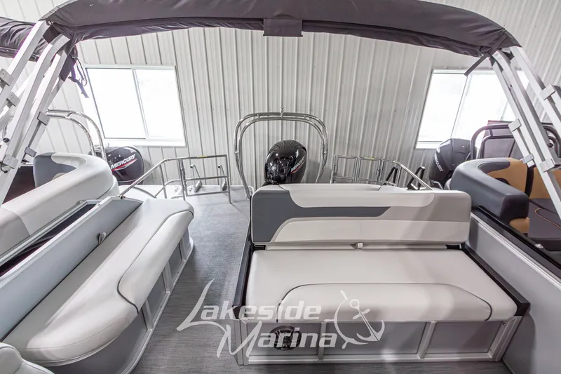 Slide: The Image of 2026 Godfrey Monaco 235 SFLC pontoon boat interior with seating and Mercury engine. - 19