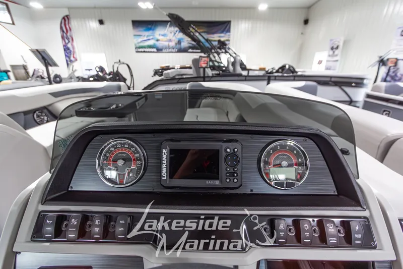 Slide: The Image of Dashboard of 2026 Godfrey Monaco 235 SFLC boat at Lakeside Marina showroom. - 16
