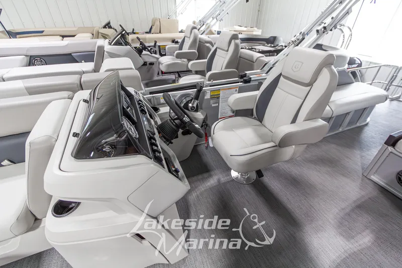 Slide: The Image of 2026 Godfrey Monaco 235 SFLC boat interior with modern helm and seating at Lakeside Marina. - 14