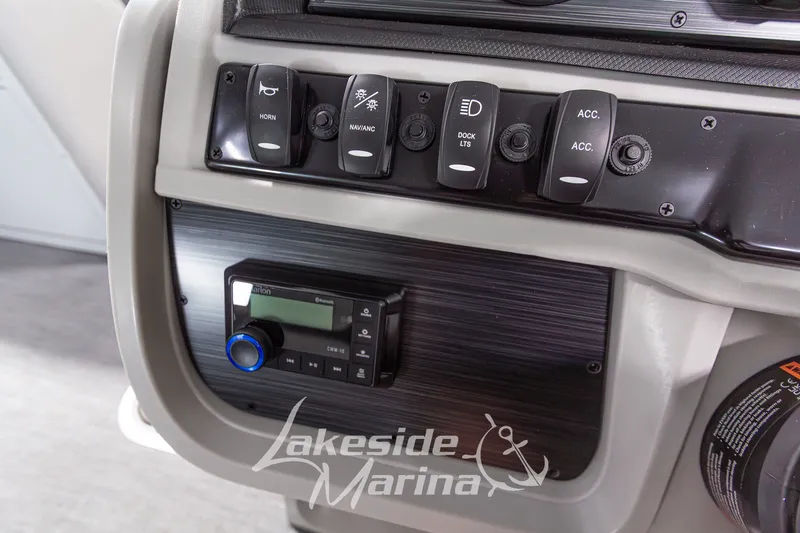 Slide: The Image of Control panel of 2026 Godfrey Monaco 235 SFLC boat with switches and stereo system. - 17