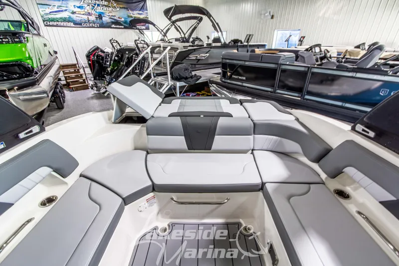 Slide: The Image of 2026 Chaparral 23 SSi boat interior with luxurious seating at Lakeside Marina showroom. - 8