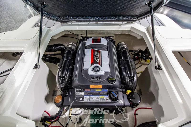Slide: The Image of 2026 Chaparral 23 SSi boat engine compartment showcasing a powerful Mercury 4.5L engine. - 10