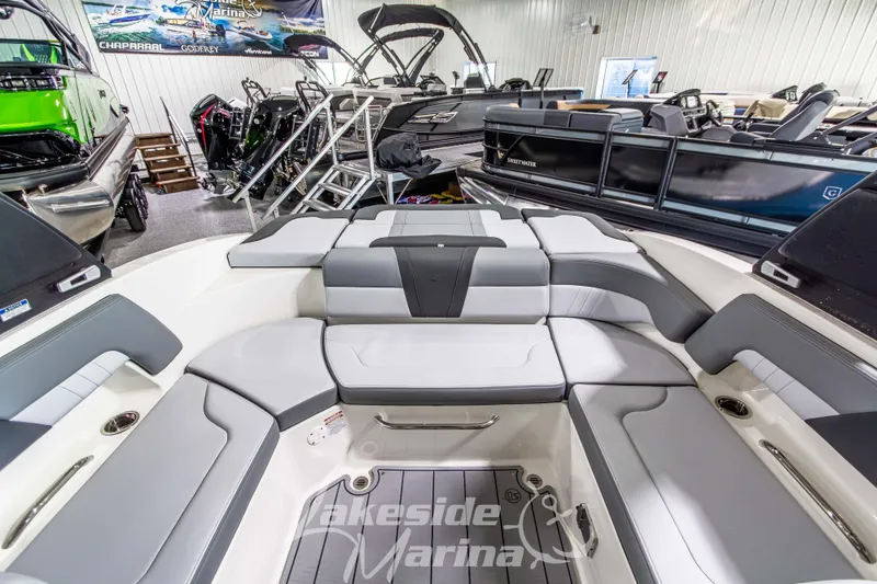 Slide: The Image of 2026 Chaparral 23 SSi boat interior with luxurious seating at Lakeside Marina. - 6