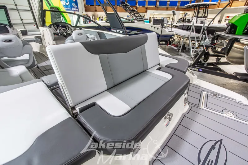 Slide: The Image of 2026 Chaparral 23 SSi boat interior with sleek gray seating and modern design. - 3