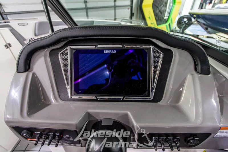 Slide: The Image of Dashboard of 2026 Chaparral 23 SSi boat with Simrad display at Lakeside Marina. - 13