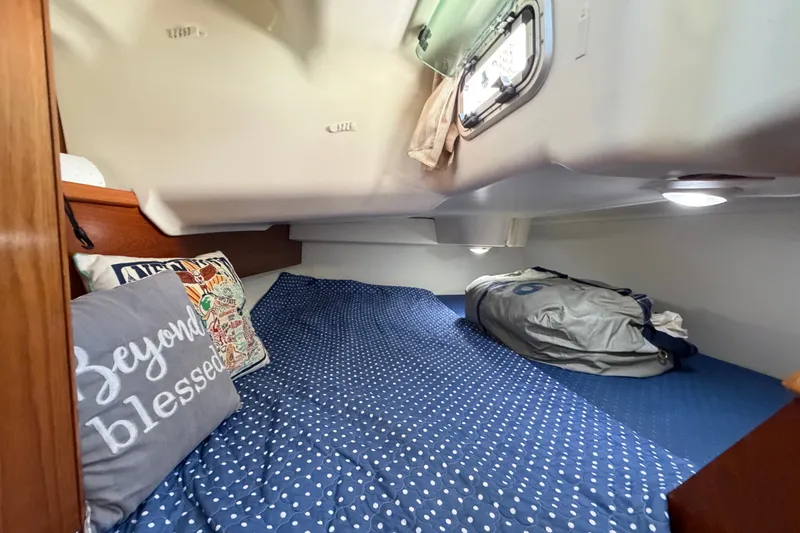 Slide: The Image of Cozy cabin interior of 2003 Jeanneau Sun Fast 37 sailboat with polka dot bedding. - 36