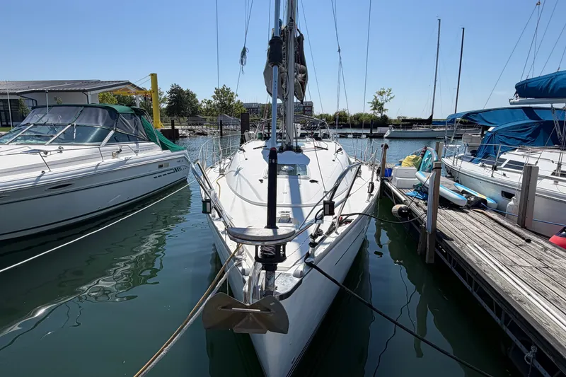 Slide: The Image of 2003 Jeanneau Sun Fast 37 sailboat docked at marina, surrounded by other boats. - 1