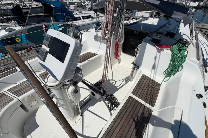 Slide: The Image of Cockpit of 2003 Jeanneau Sun Fast 37 sailboat with steering wheel and navigation equipment. - 14