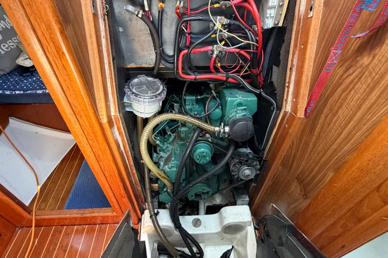 Slide: The Image of Engine compartment of a 2003 Jeanneau Sun Fast 37 sailboat, showcasing wiring and components. - 39
