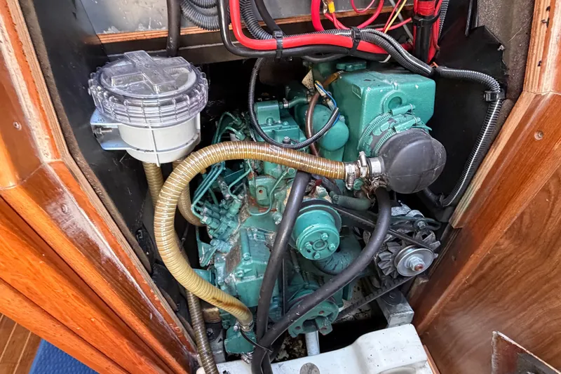 Slide: The Image of Engine compartment of a 2003 Jeanneau Sun Fast 37 sailboat, showcasing mechanical components. - 41