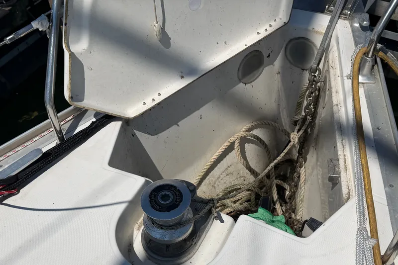 Slide: The Image of Anchor locker of a 2003 Jeanneau Sun Fast 37 sailboat with ropes and winch. - 4