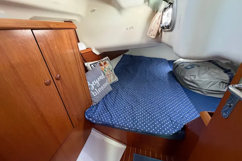 Slide: The Image of Cozy cabin interior of 2003 Jeanneau Sun Fast 37 sailboat with polka dot bedding. - 34