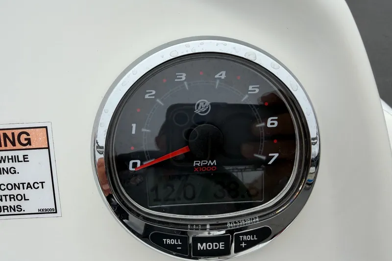 Slide: The Image of Close-up of a 2024 Zodiac Yachtline 490 tachometer displaying RPM readings. - 12