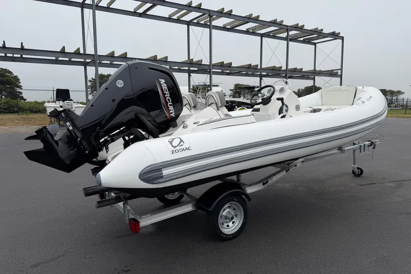Slide: The Image of 2024 Zodiac Yachtline 490 inflatable boat with Mercury engine on a trailer. - 4