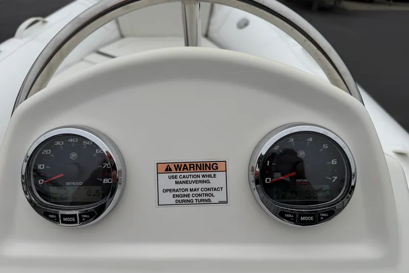 Slide: The Image of Dashboard of 2024 Zodiac Yachtline 490 with speedometer and RPM gauges. - 11