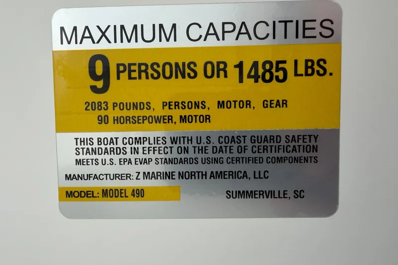 Slide: The Image of Zodiac Yachtline 490 capacity label: 9 persons, 1485 lbs, 90 horsepower, 2024 model. - 13