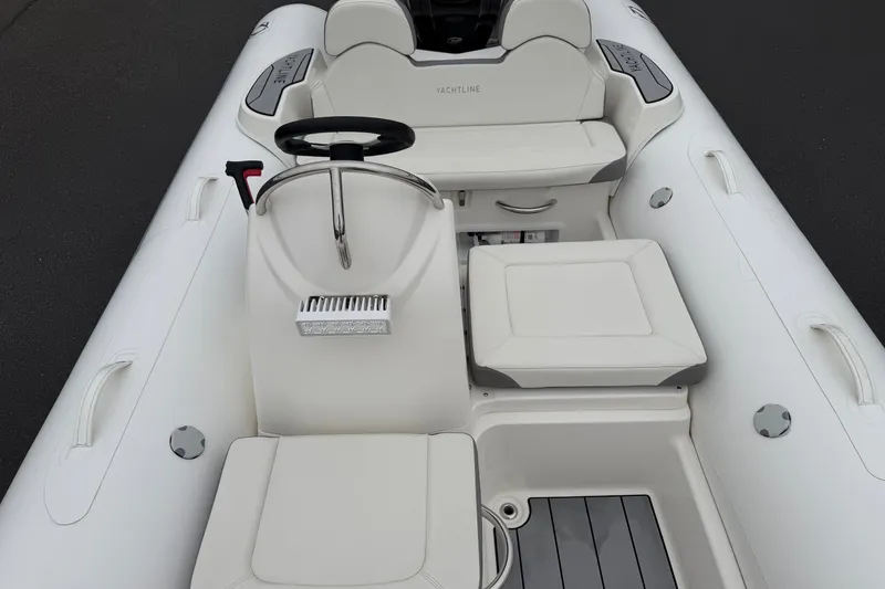 Slide: The Image of 2024 Zodiac Yachtline 490 inflatable boat interior with steering console and seating. - 7