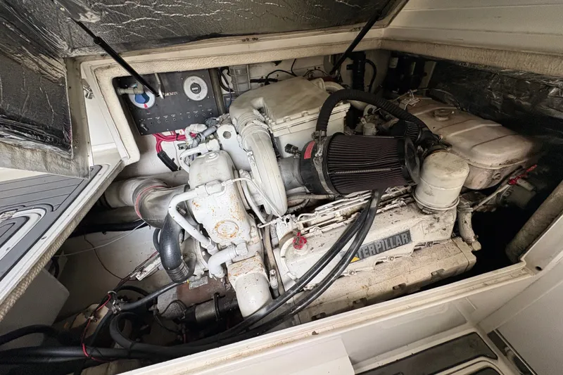 Slide: The Image of Engine compartment of a 2001 Blackfin 33 Flybridge boat, featuring a Caterpillar engine. - 13