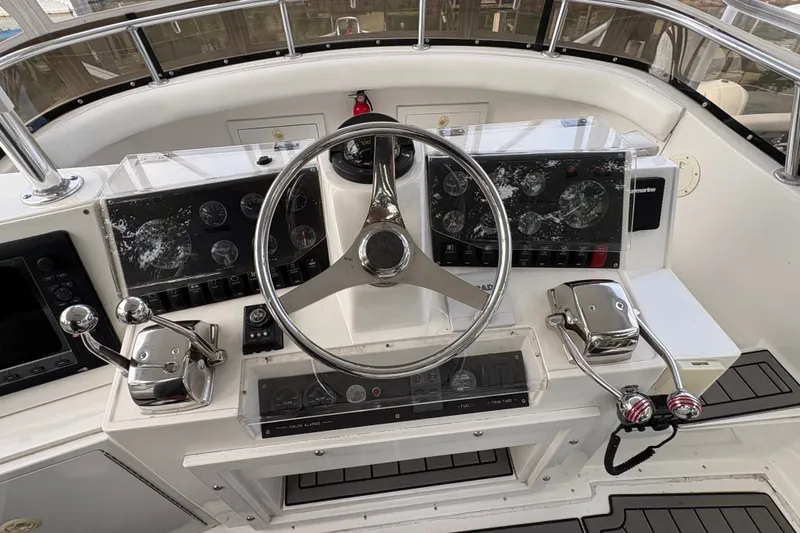 Slide: The Image of Cockpit of 2001 Blackfin 33 Flybridge with steering wheel and control panels. - 8