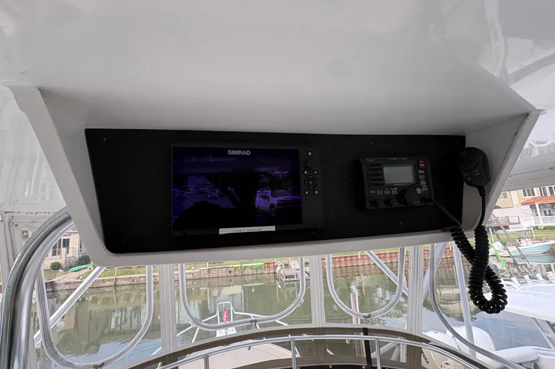 Slide: The Image of Flybridge electronics on 2001 Blackfin 33, featuring Simrad display and communication equipment. - 10