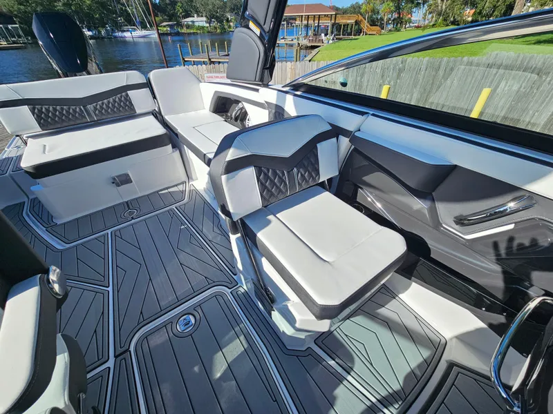 Slide: The Image of 2025 Monterey 255SS boat interior with modern seating and sleek design. - 31