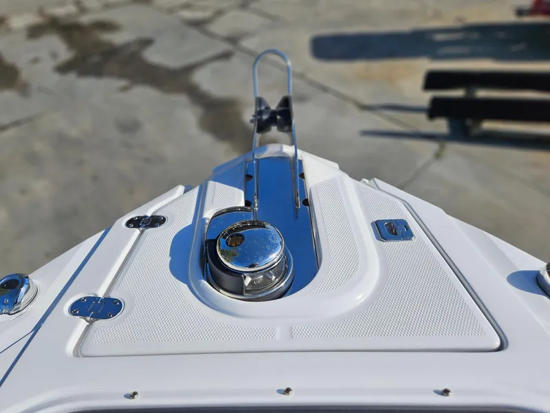 Slide: The Image of Bow of 2025 Monterey 255SS boat with chrome fittings and anchor holder. - 25