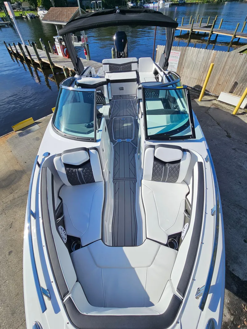 Slide: The Image of 2025 Monterey 255SS boat with sleek design docked by the water. - 26