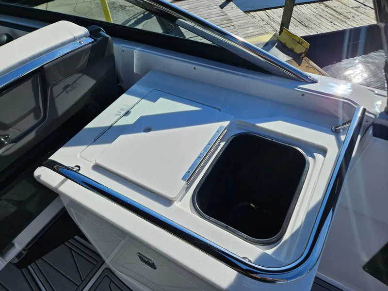 Slide: The Image of 2025 Monterey 255SS boat interior with sink and storage area. - 18