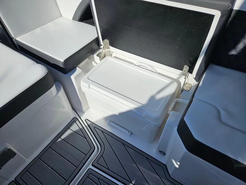 Slide: The Image of 2025 Monterey 255SS boat interior with seating and storage compartment. - 20