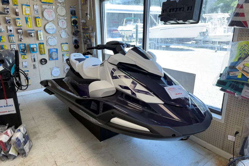 The Image of 2026 Yamaha WaveRunner VX Cruiser HO displayed in a showroom with boating accessories. - 0