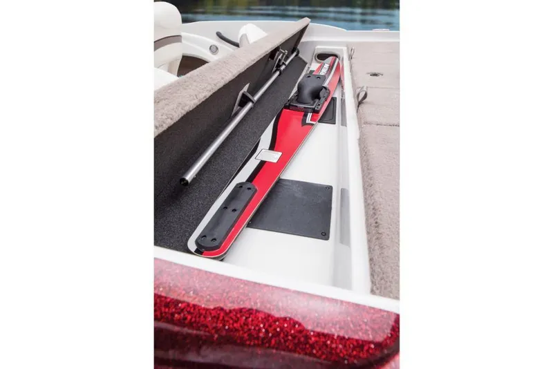 Slide: The Image of An open storage compartment on a 2016 Nitro Z-7 Sport boat reveals red water ski equipment. - 19