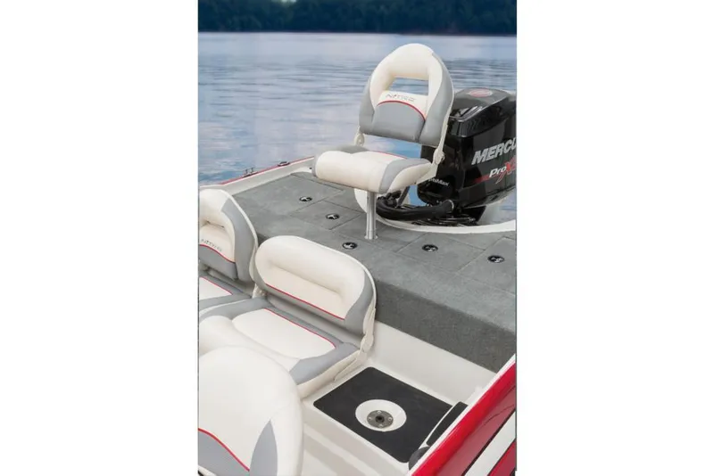 Slide: The Image of A 2016 Nitro Z-7 Sport boat with gray and white seats on calm water. - 22