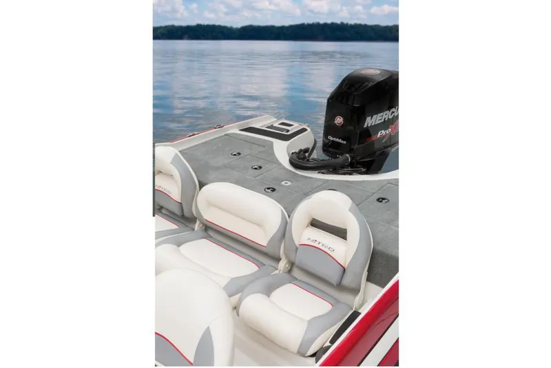 Slide: The Image of A 2016 Nitro Z-7 Sport boat with white and gray seats and a Mercury engine. - 23