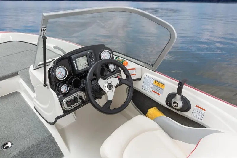 Slide: The Image of The image shows the cockpit of a 2016 Nitro Z-7 Sport boat with steering wheel and instruments. - 14