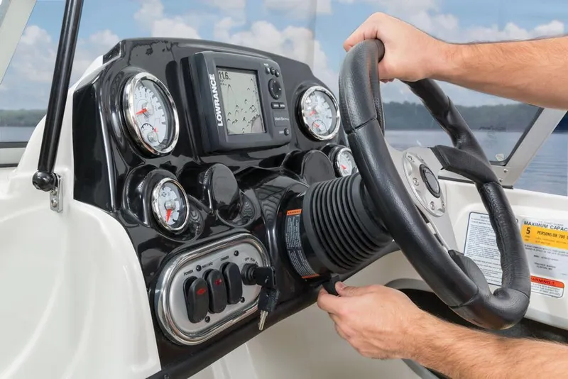Slide: The Image of Close-up of a Nitro Z-7 Sport boat's helm with instruments and steering wheel. - 16