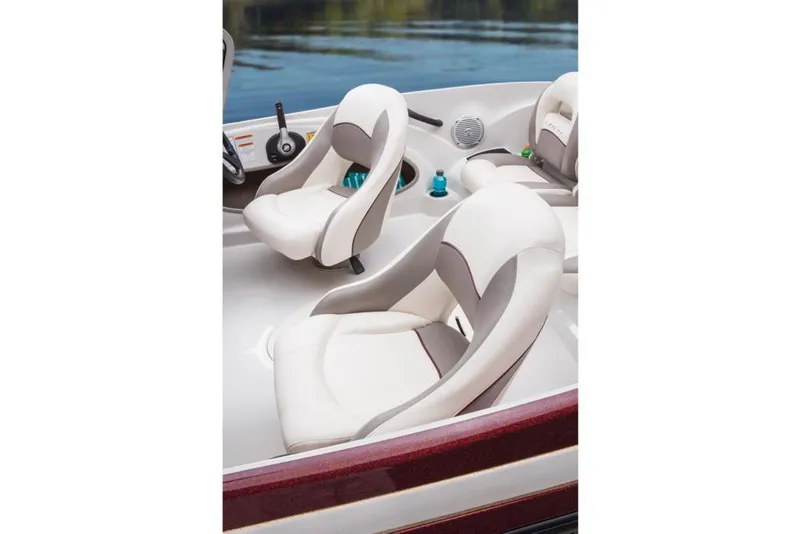 Slide: The Image of The image shows the seats of a 2016 Nitro Z-7 Sport boat with white upholstery. - 24