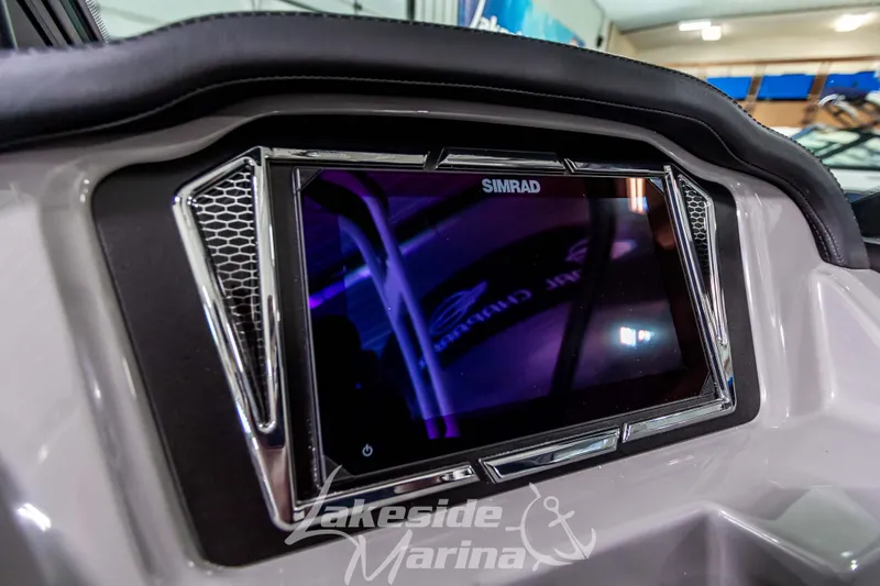 Slide: The Image of 2026 Chaparral 21 SSi dashboard with Simrad display at Lakeside Marina. - 15