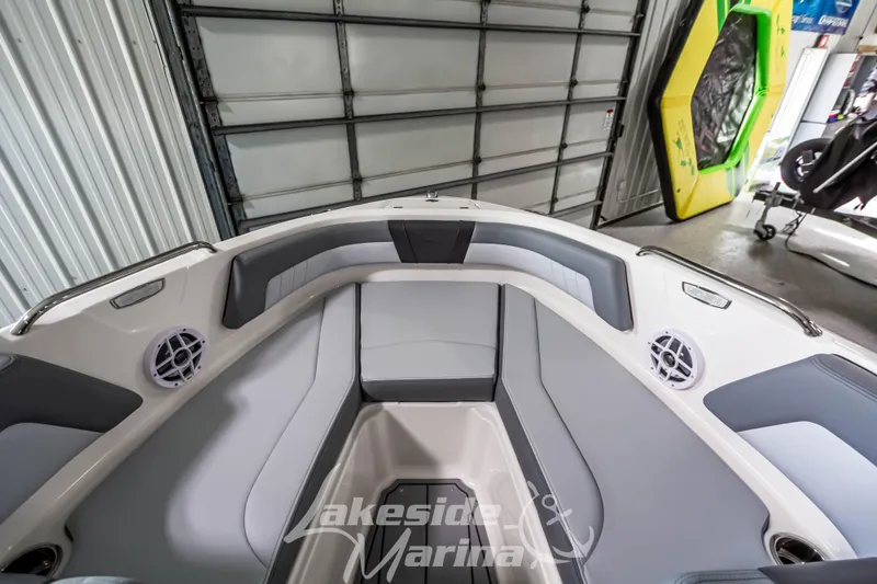 Slide: The Image of Interior of 2026 Chaparral 21 SSi boat with gray seating and speakers. - 21