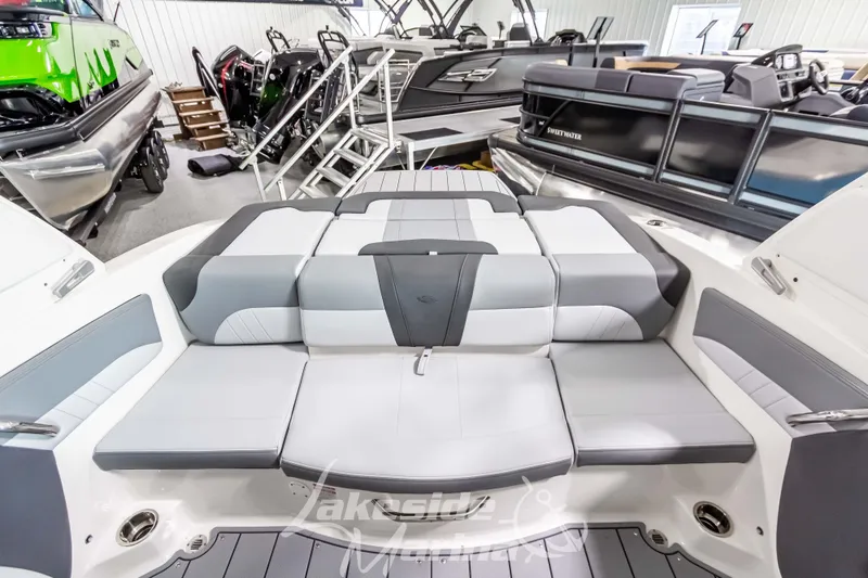 Slide: The Image of 2026 Chaparral 21 SSi boat interior with gray seating in showroom. - 6