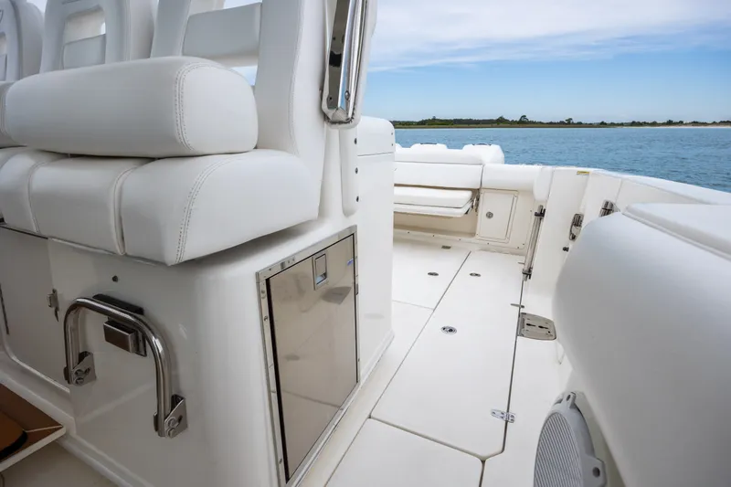 Slide: The Image of 2017 Boston Whaler 370 Outrage interior with white seating and ocean view. - 32