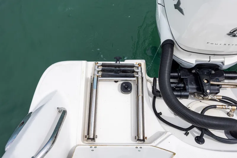Slide: The Image of 2017 Boston Whaler 370 Outrage boat stern with ladder and engine details. - 15