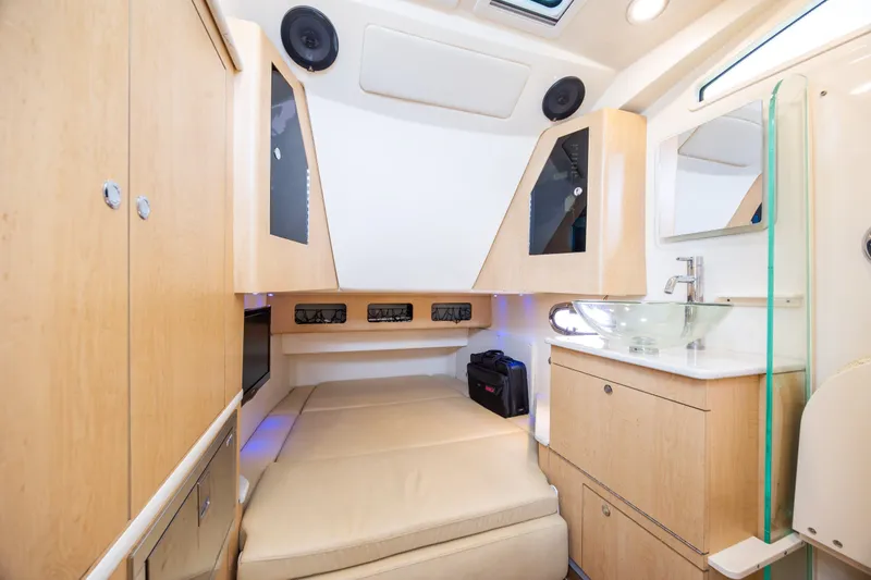 Slide: The Image of 2017 Boston Whaler 370 Outrage cabin interior with modern amenities and sleek design. - 44