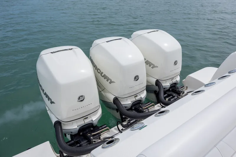 Slide: The Image of Triple Mercury outboard engines on a 2017 Boston Whaler 370 Outrage boat. - 14