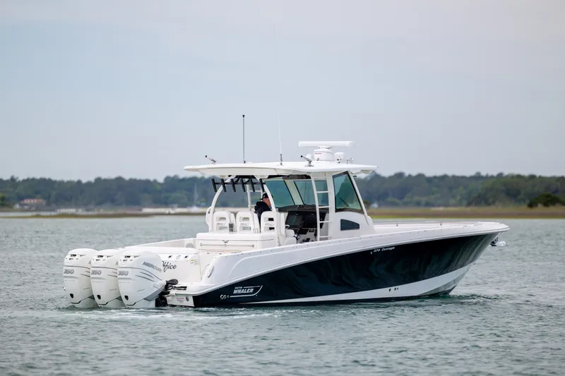 Slide: The Image of 2017 Boston Whaler 370 Outrage boat cruising on calm waters. - 5