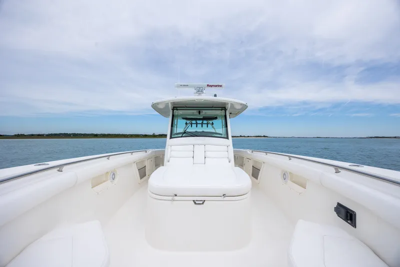 Slide: The Image of 2017 Boston Whaler 370 Outrage boat on calm water under a clear sky. - 39