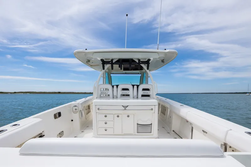 Slide: The Image of 2017 Boston Whaler 370 Outrage boat on calm water under a clear sky. - 21