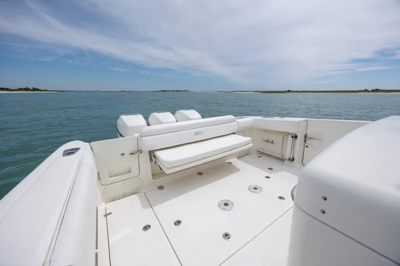 Slide: The Image of 2017 Boston Whaler 370 Outrage boat deck with seating, ocean view. - 16