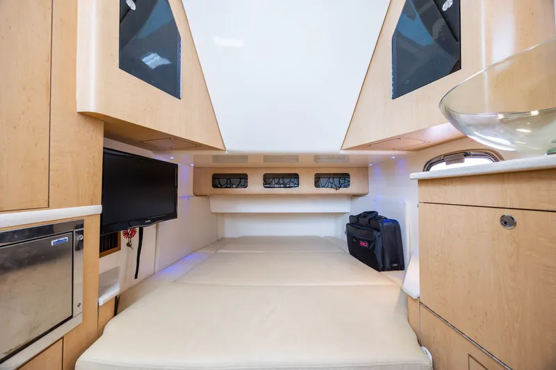 Slide: The Image of Interior cabin of 2017 Boston Whaler 370 Outrage, featuring modern amenities and comfortable seating. - 47